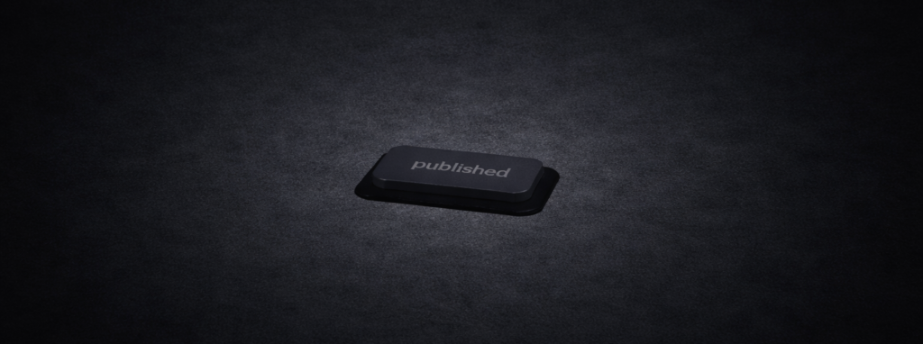 A "published" button in the distance, pressed flat against a dark background — already clicked, no taking it back.